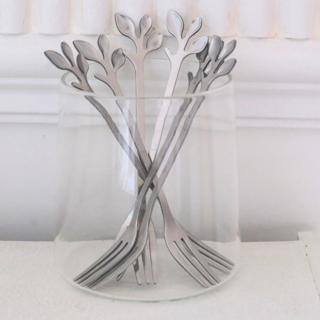 Premium silver appetizer forks featuring a nature-inspired leaf handle design.