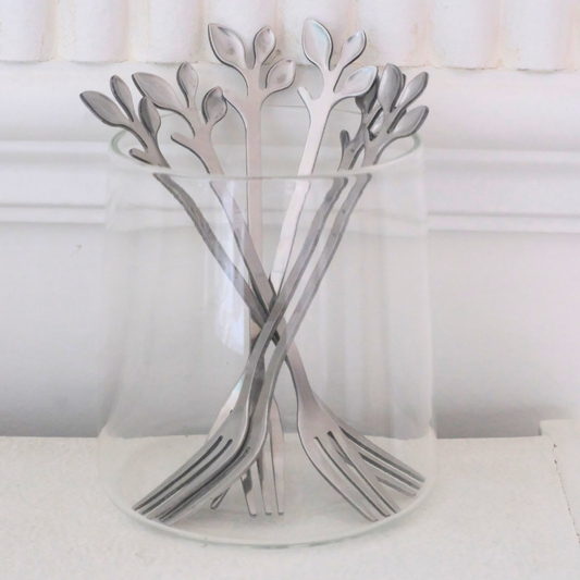 Premium silver appetizer forks featuring a nature-inspired leaf handle design.