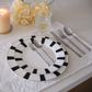 5 Pc Silver Cutlery Set placed on white textured runner with water glass and Hurricane