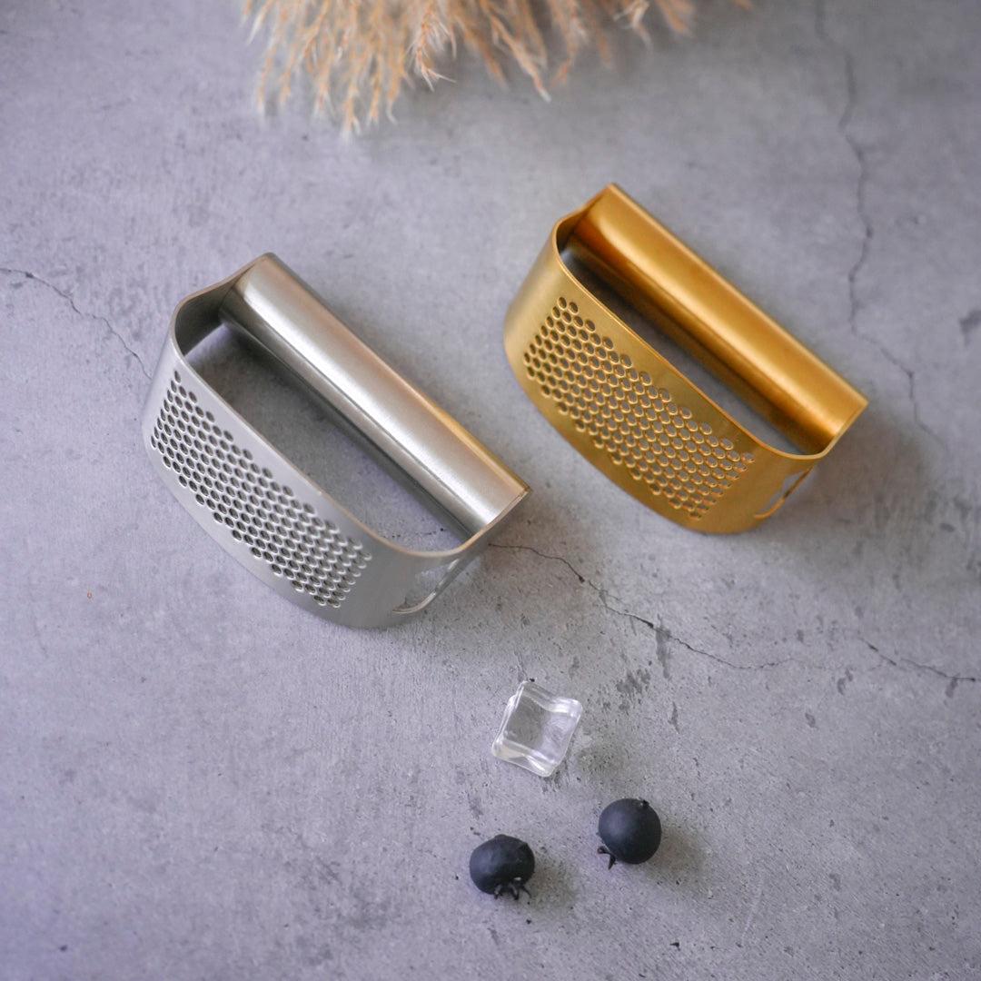 Stainless steel garlic press and masher in gold and silver finish finish