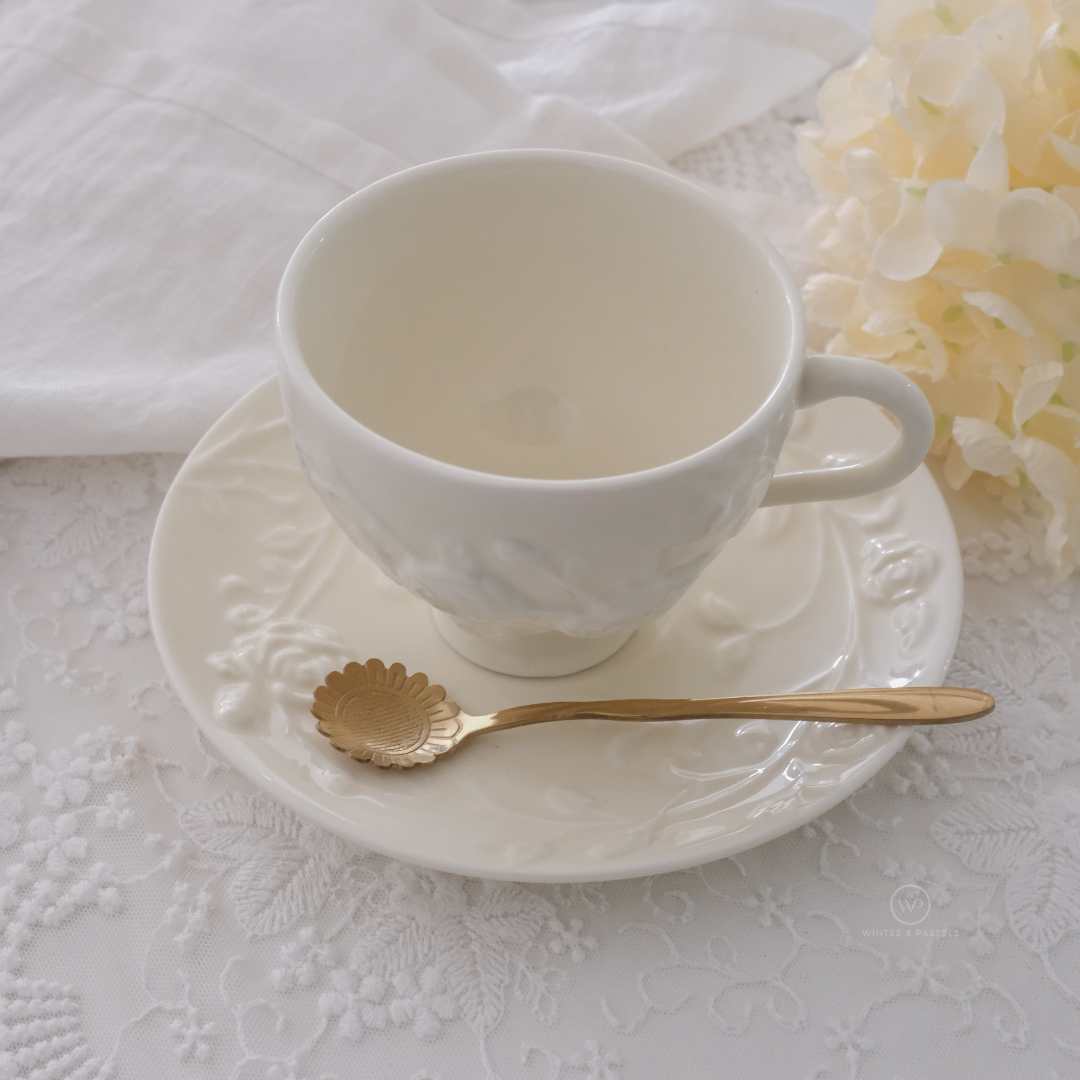 Gold dessert spoons with sunflower detailing