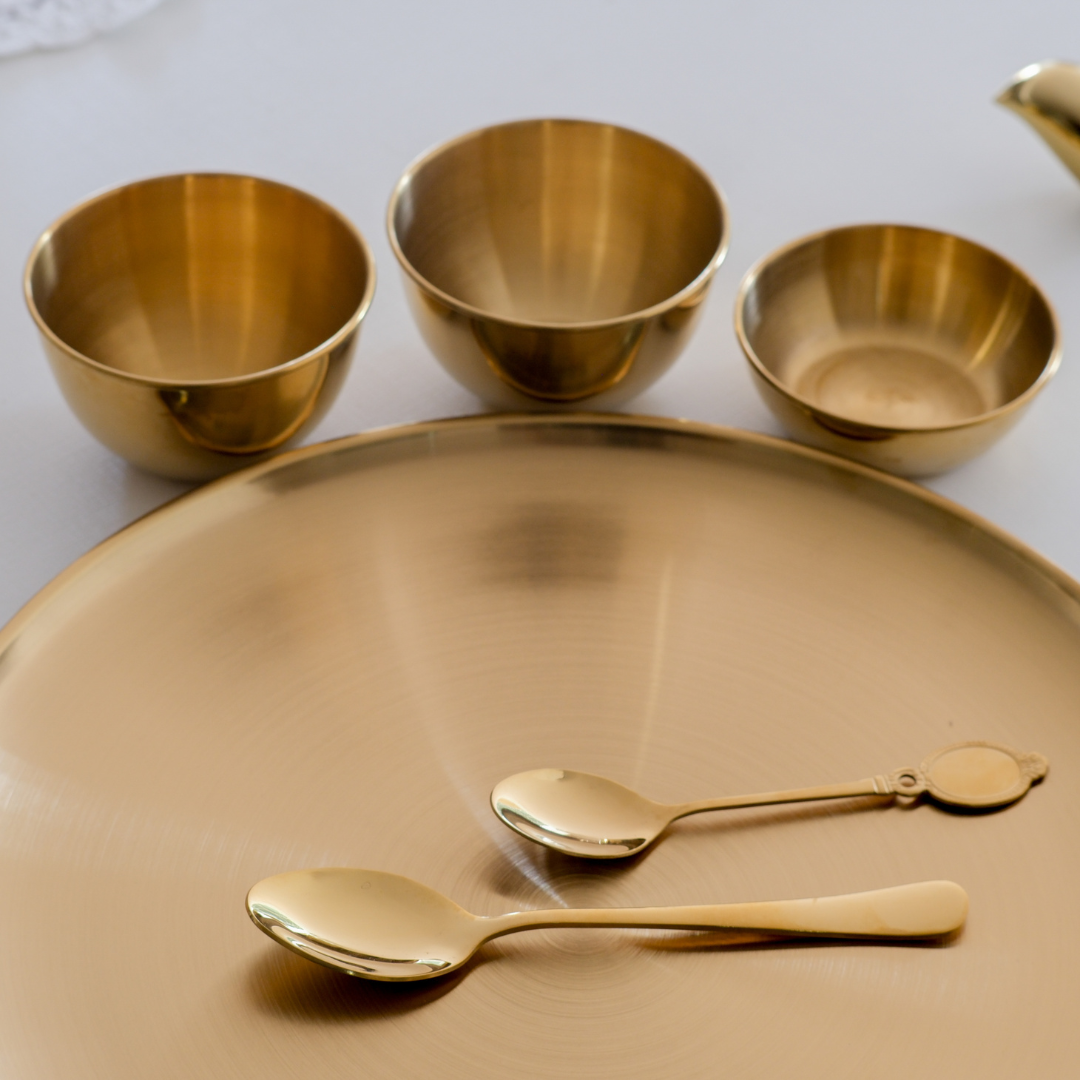 Premium S.S thali dinner set with plates, bowls, glasses and spoons.