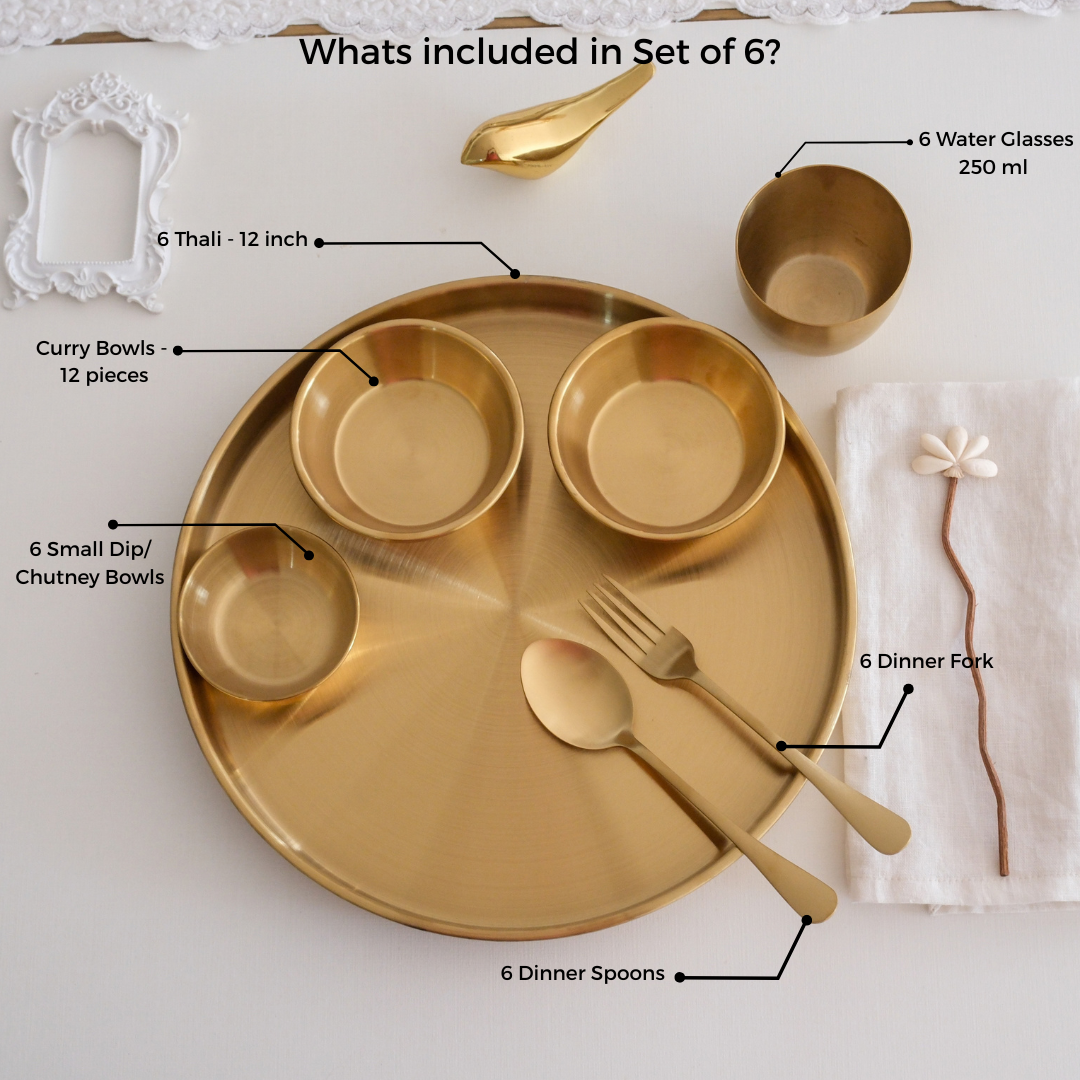 Luxury gold stainless steel thali set for 6 people with 12-inch plates, curry bowls, chutney bowls, water glasses, forks, and spoons, complete Indian dining dinnerware set.