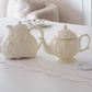 Elegant Victorian porcelain tea pot with embossed detailing, perfect for afternoon tea and high tea setups.