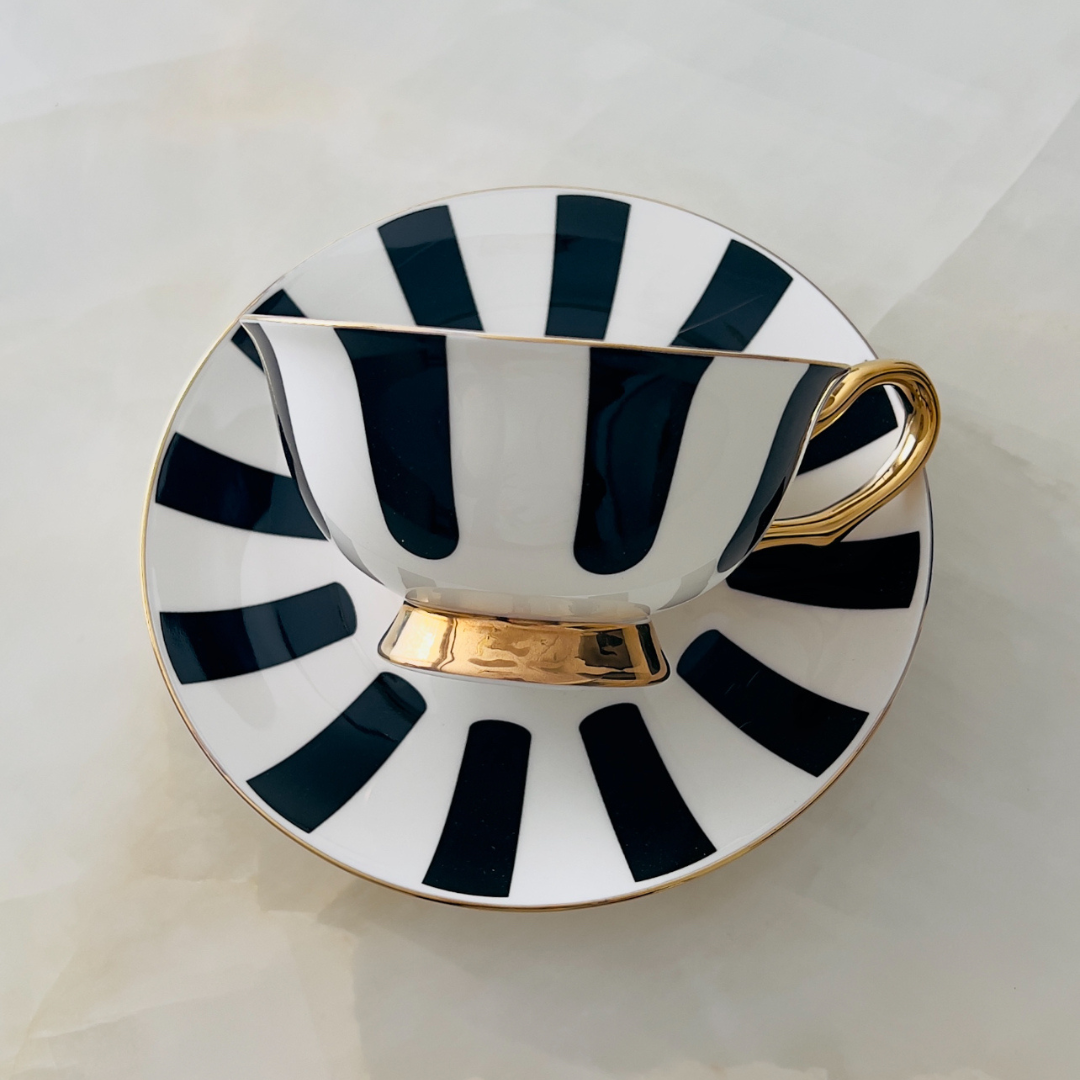 Cup Set
Designer black and white striped porcelain tea cup and saucer set with premium floral gift box.
