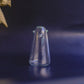 Penguin glass vase used as cocktail pick holder