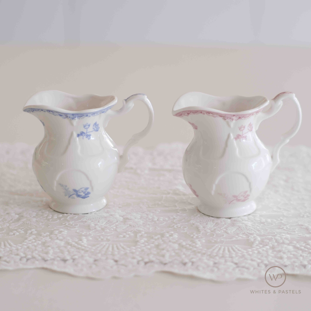 White porcelain creamer jar with pink floral print and embossed design