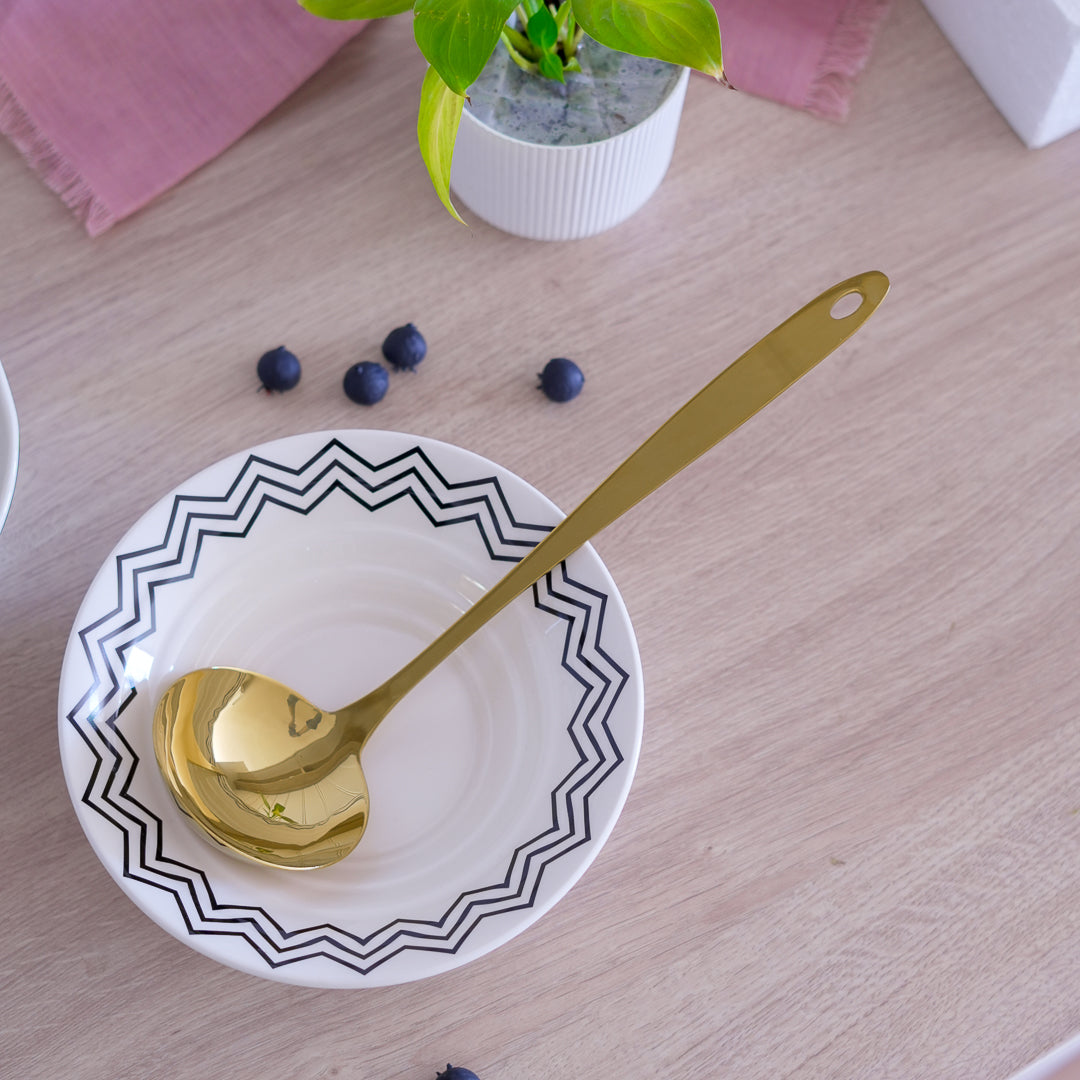 gold serving spoon