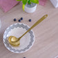 gold serving spoon
