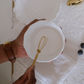 A women trying to use our egg whisker to whisk egss for omlet