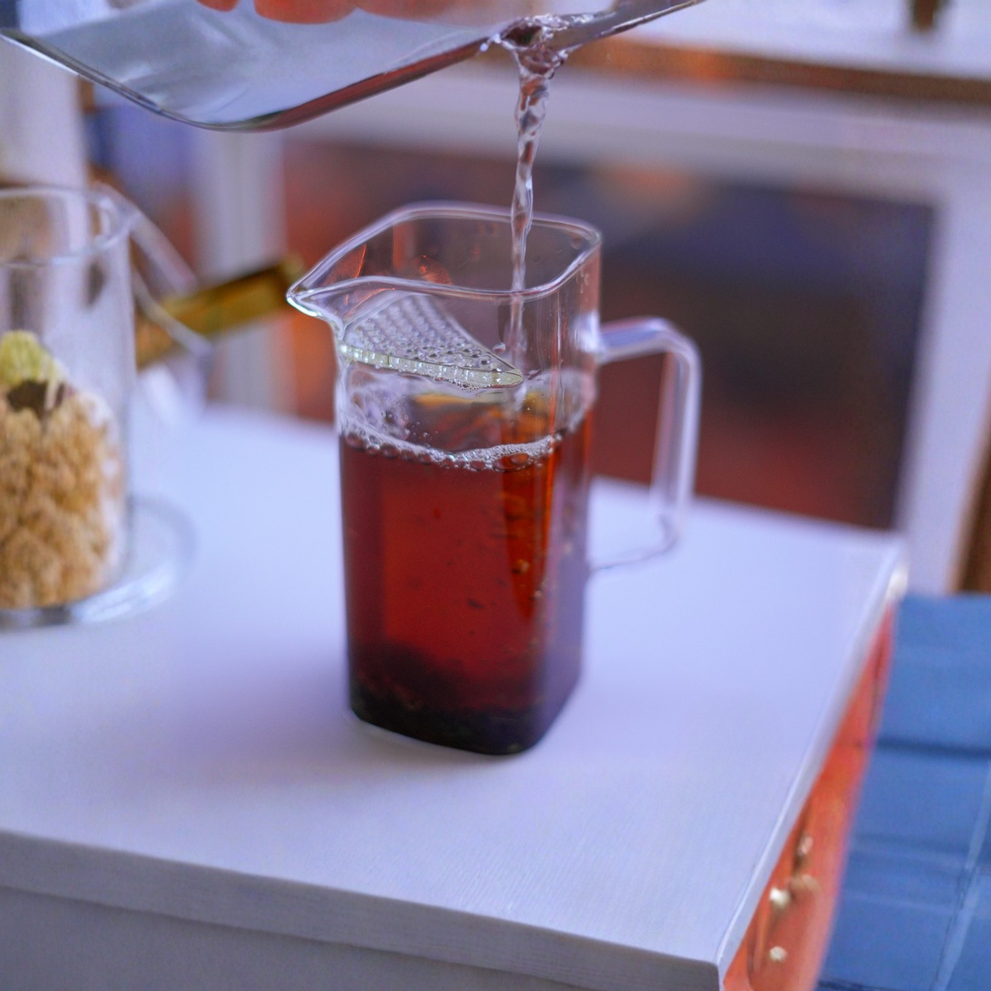 Top view of premium borosilicate glass tea cup with built-in filter and spout