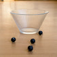 Elegant fluted glass bowl for modern dining table