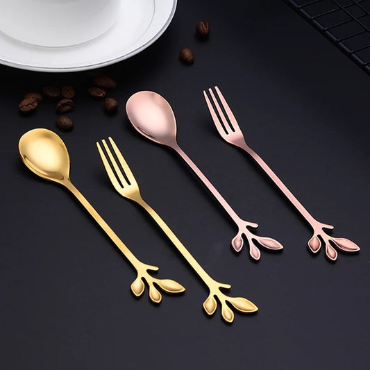 A set of dessert spoons and fruit forks with leaf designs, featuring colors rose gold and gold.