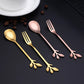 A set of dessert spoons and fruit forks with leaf designs, featuring colors rose gold and gold.